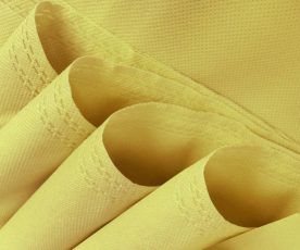 four rolls of beige non-woven fabric. polypropylene bag