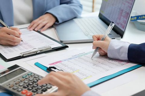 Expert woman asian female people review data number costing managerial account prepare monthly actual cost variance report income tax at audit office. ESG budget control ERP process service project.