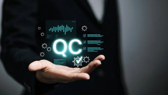 Businessperson presenting glowing QC letters with analytics panels, checklist and gears. Concept for quality control, inspection, process audit, compliance, KPI metrics and manufacturing assurance.